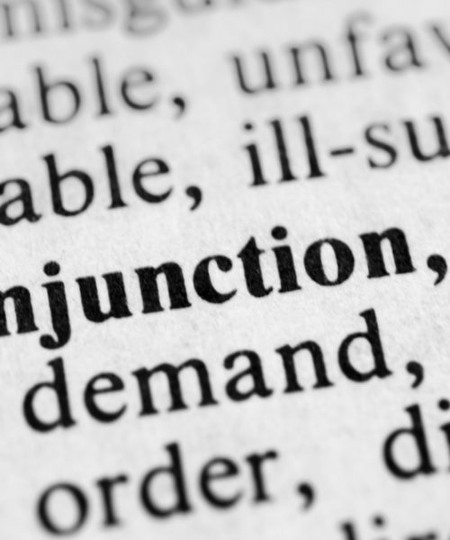 A text illustration of dictionary extract with the word injunction highlighted