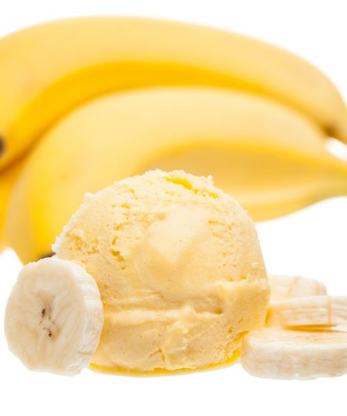 A big scoop of ice cream long along side ripe bananas and some banana slices