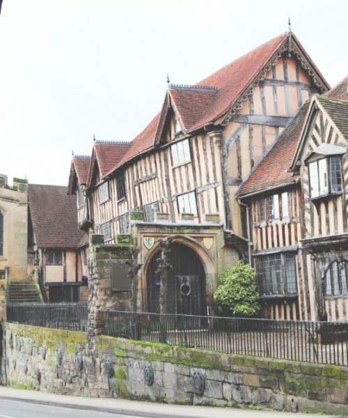 An exterior photograph showing the buildings at Lord Leycester Hospital in Warwick, the buildings are old so are leaning in different directions